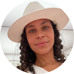 Headshot of Sarah Kolker in a white cowboy hat